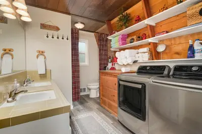 a kitchen with a sink and a stove at Fire Escape Cabin-Southern Yosemite in Oakhurst