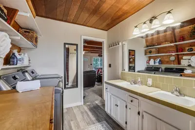 a kitchen with two sinks and a counter top at Fire Escape Cabin-Southern Yosemite in Oakhurst