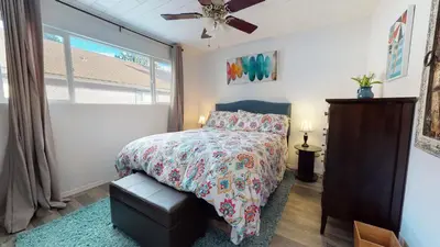 a bedroom with a bed and a ceiling fan at Sierra Manors In the Heart of Mammoth in Mammoth Lakes