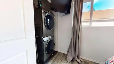 a washer and dryer in a room with a window at Sierra Manors In the Heart of Mammoth in Mammoth Lakes