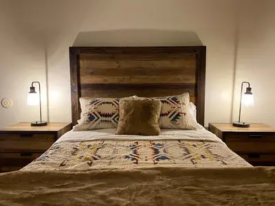a bedroom with a large bed with two lamps at Sierra Manors #098 Nearby Hike & Bike Trails in Mammoth Lakes