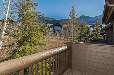 a balcony with a view of a house at SnowCreek #936 Shared Pool & Hot Tub in Mammoth Lakes
