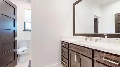 a bathroom with a sink and a toilet and a mirror at Cozy Cabin for 8 Close to Eagle Lodge in Mammoth Lakes