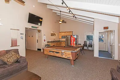 a living room with a pool table in it at St Anton Getaway Shared BBQ Pool & Hot Tub in Mammoth Lakes
