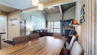 a living room with a wooden table and chairs at Chamonix #70 Near Yearly Outdoor Activities in Mammoth Lakes