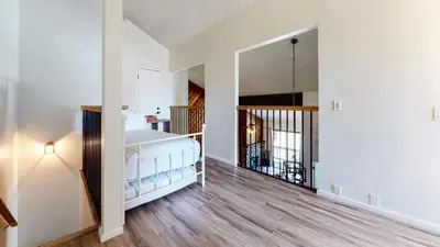 a white room with a bed and a mirror at Crestview #2 Close to The Village Near Year-Round Outdoor Activities in Mammoth Lakes
