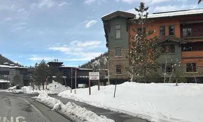 a snow covered street in front of a building at Fireside at The Village Near Hike Bike in Mammoth Lakes