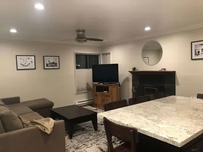 a living room with a couch and a table at Fireside at The Village Near Hike Bike in Mammoth Lakes
