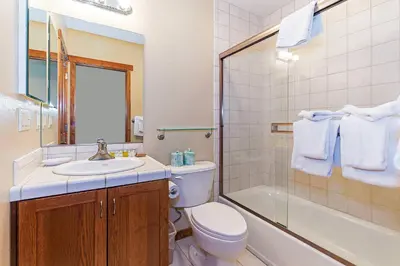 a bathroom with a toilet and a sink and a shower at Grayeagle 08 Cozy Ambiance with Hot Tub in Mammoth Lakes