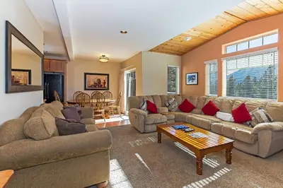 a living room with couches and a coffee table at Grayeagle 08 Cozy Ambiance with Hot Tub in Mammoth Lakes
