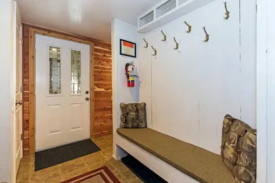 a room with a door with a bench and a fire hydrant at Horizons 4 Year-Round Outdoor Activities in Mammoth Lakes