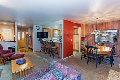 a living room with a couch and a table at Horizons Communal Sauna & Hot Tub in Mammoth Lakes