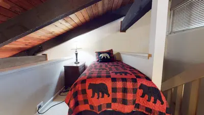 a bedroom with a bed in a attic at Horizons 4 Communal Rec Room & Pool in Mammoth Lakes