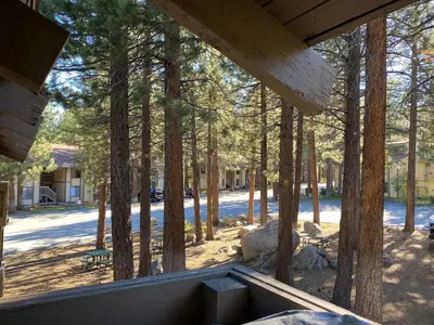 a view from the porch of a house with trees at Horizons 4 Communal Rec Room & Pool in Mammoth Lakes