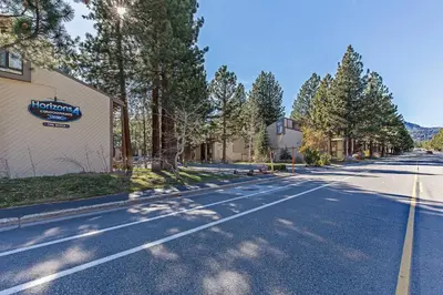 an empty street with trees on the side of a building at Horizons 4 Communal Rec Room & Pool in Mammoth Lakes