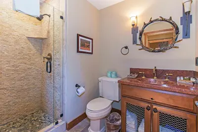 a bathroom with a toilet and a sink and a shower at Stonegate #02 Luxe Condo with Foosball Table in Mammoth Lakes