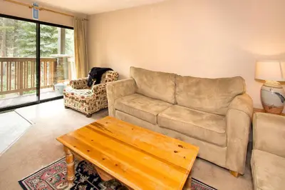 a living room with a couch and a coffee table at Summit #217 A Couples Getaway Dream in Mammoth Lakes