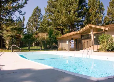 a swimming pool in front of a house at Villa De Los Pinos #33 Year-Round Activities in Mammoth Lakes