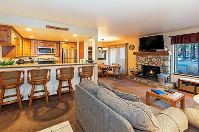 a living room with a couch and a kitchen at Horizons 4 - Excellent for Groups in Mammoth Lakes