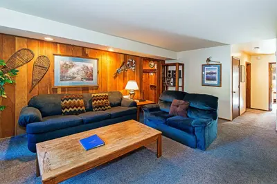 a living room with two couches and a coffee table at Horizons 4 - Pool & Hot Tub Access in Mammoth Lakes
