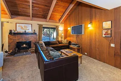 a living room with a couch and a fireplace at Horizons 4 - Walk to Shops & Eateries in Mammoth Lakes