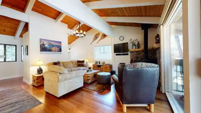 a living room with a couch and a chair at Villa De Los Pinos Year-Round Activities Nearby Shopping & Restaurants in Mammoth Lakes