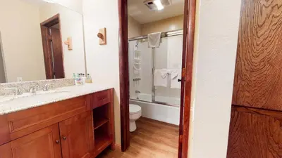 a bathroom with a sink and a toilet and a shower at Horizons Bliss - Near Year-Round Activities in Mammoth Lakes