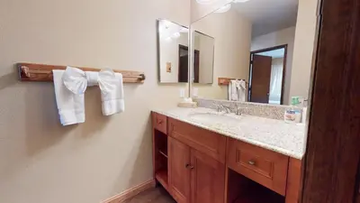 a bathroom with a sink and a mirror at Horizons Bliss - Near Year-Round Activities in Mammoth Lakes