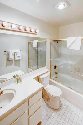 a bathroom with a toilet sink and a shower at Winterset #01 Condo Near Year-Round Fun in Mammoth Lakes