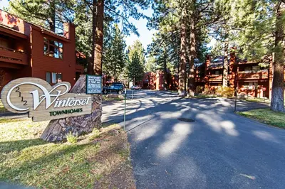 a sign for aumedumed homestead in front of a building at Winterset #01 Condo Near Year-Round Fun in Mammoth Lakes