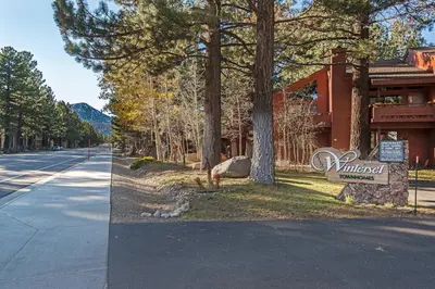 a building with a sign next to a street at Winterset #02 Shared Hot Tub & Pool in Mammoth Lakes