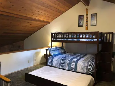 a bedroom with a bunk bed in a house at Winterset #02 Shared Hot Tub & Pool in Mammoth Lakes