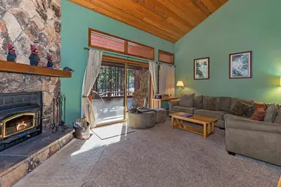 a living room with a couch and a fireplace at Winterset #18 Shared Pool & Near Skiing in Mammoth Lakes