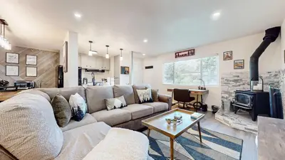 a living room with a couch and a table at Jackson's Alpine Retreat - For 4 in Mammoth Lakes