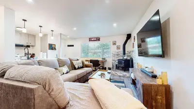 a living room with a couch and a tv at Jackson's Alpine Retreat - For 4 in Mammoth Lakes