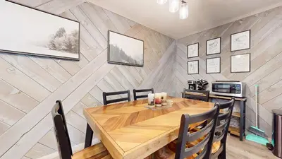 a dining room with a wooden table and chairs at Jackson's Alpine Retreat - For 4 in Mammoth Lakes