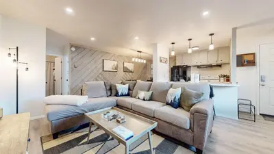 a living room with a couch and a table at Jackson's Alpine Retreat - For 4 in Mammoth Lakes