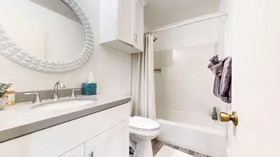 a white bathroom with a sink and a mirror at Cozy Condo for 4 Near Shuttle & Eagle Lodge in Mammoth Lakes