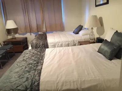 a hotel room with two beds and a window at La Residence - Near Shuttle and Hike & Bike Trails in Mammoth Lakes