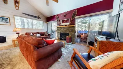 a living room with leather furniture and a fireplace at La Residence - Shared Pool Hot Tub & More in Mammoth Lakes
