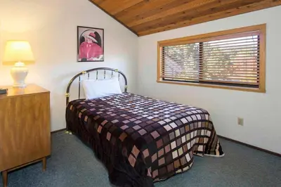 a bedroom with a bed and a window at La Vista Blanc #22 - Near Shuttle BBQ & Pool in Mammoth Lakes