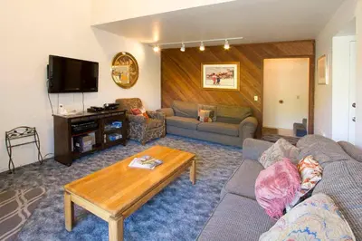 a living room with a couch and a table at La Vista Blanc #22 - Near Shuttle BBQ & Pool in Mammoth Lakes