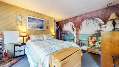 a bedroom with a bed and a large window at La Vista Blanc with Year-Round Mammoth Fun in Mammoth Lakes