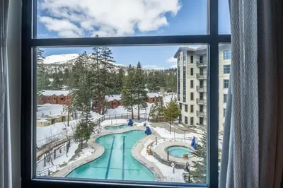 a view of a pool from a window at 2 BDR Family Resort Condo with Pool Lounge & Mountain Views in Mammoth Lakes