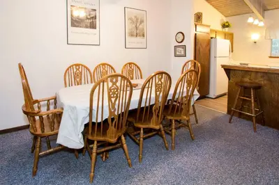 a dining room with a table and chairs at Mammoth Estates - 4 Seasons of Beauty with Accessible Amenities in Mammoth Lakes