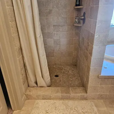 a bathroom with a shower with a shower curtain at Waterfront Elegance in Discovery Bay