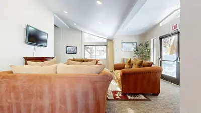 a living room with two couches and a tv at Modern Cabin for Family of 8 - Near Slopes & Canyon Lodge in Mammoth Lakes