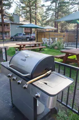 a grill sitting on top of a patio at Mountain Shadows #F02 - Near Shuttle & Shopping in Mammoth Lakes