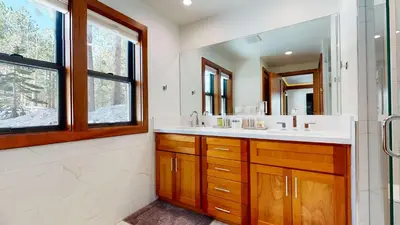 a bathroom with a sink and a mirror at Obsidian Dreaming - On the Sierra Star Golf Course in Mammoth Lakes