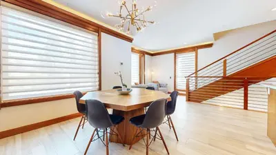a dining room with a wooden table and chairs at Obsidian Ski & Golf Villa - 3 BDR Prime Location in Mammoth Lakes